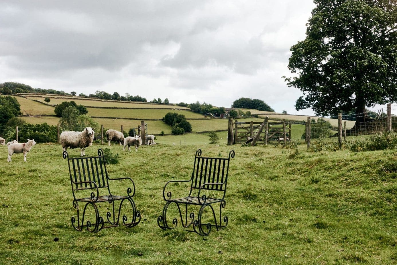 A Pair of Elegant Antique Rocking Chairs in Wrought Iron