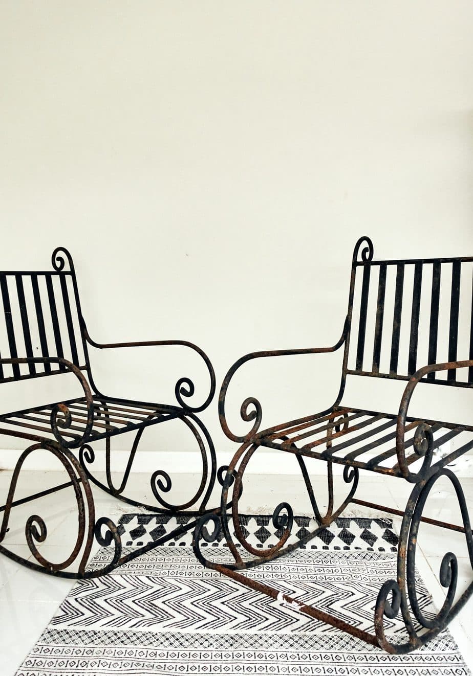 A Pair of Elegant Antique Rocking Chairs in Wrought Iron