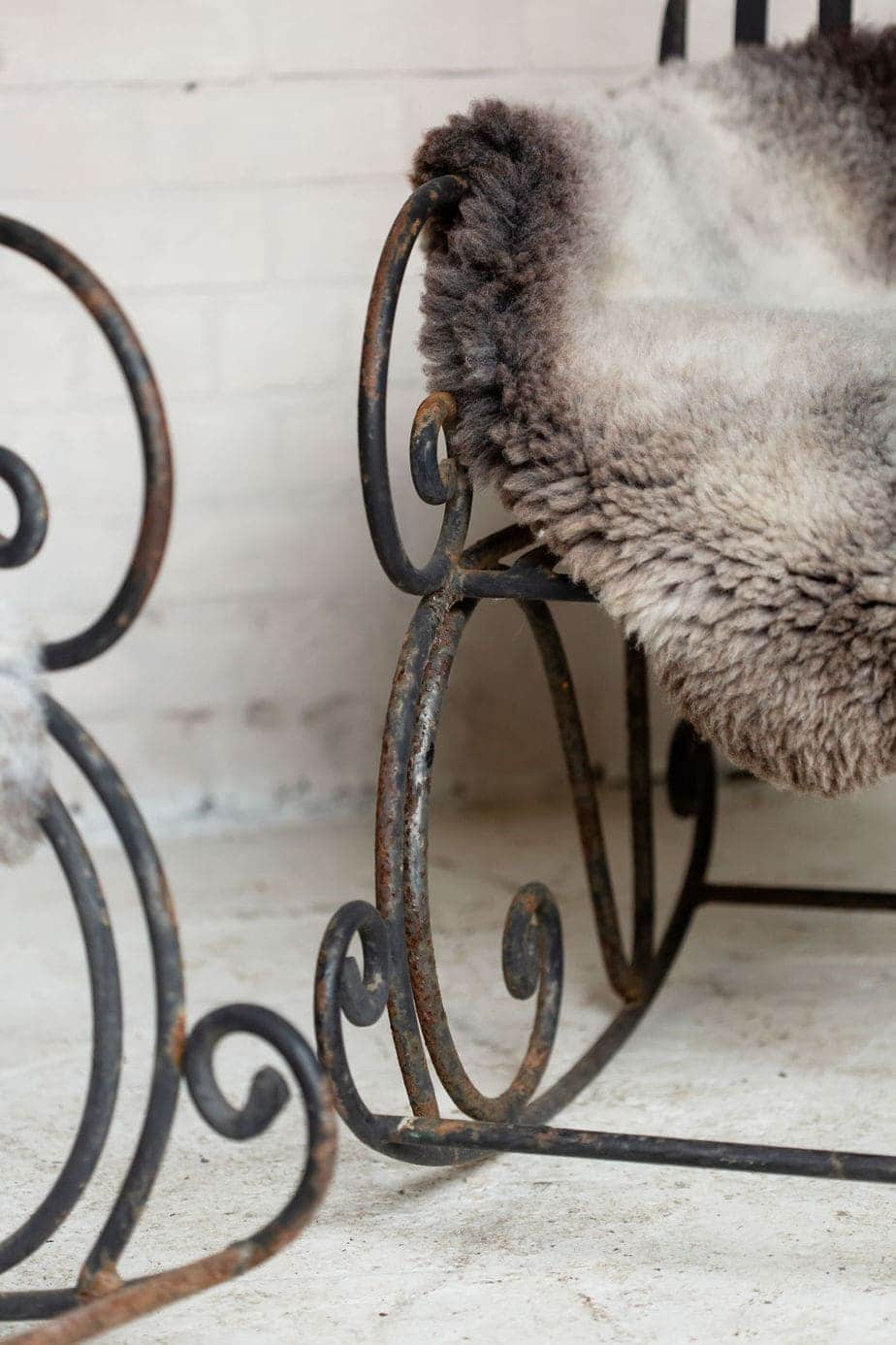 A Pair of Elegant Antique Rocking Chairs in Wrought Iron