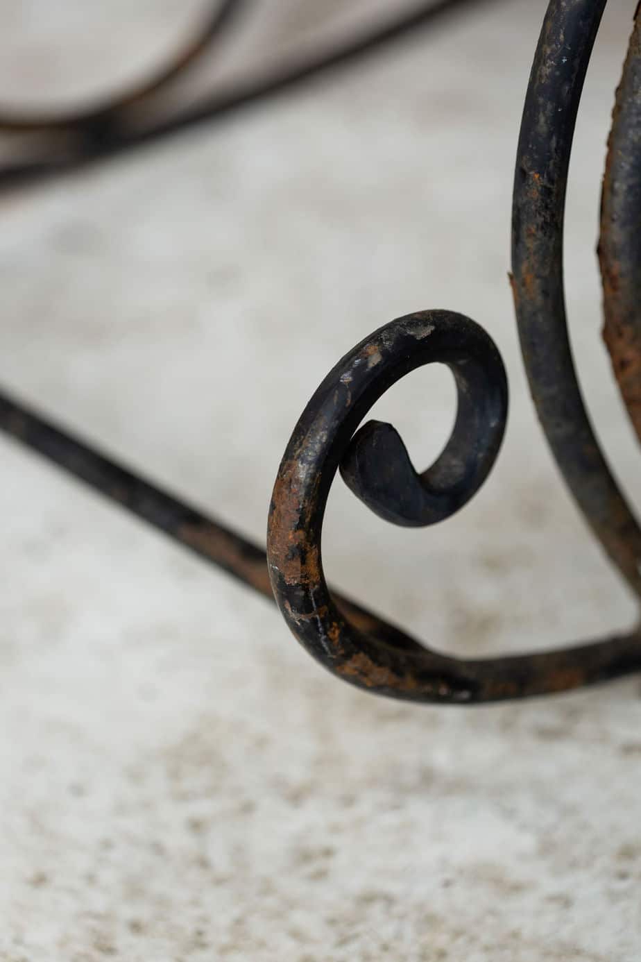 A Pair of Elegant Antique Rocking Chairs in Wrought Iron