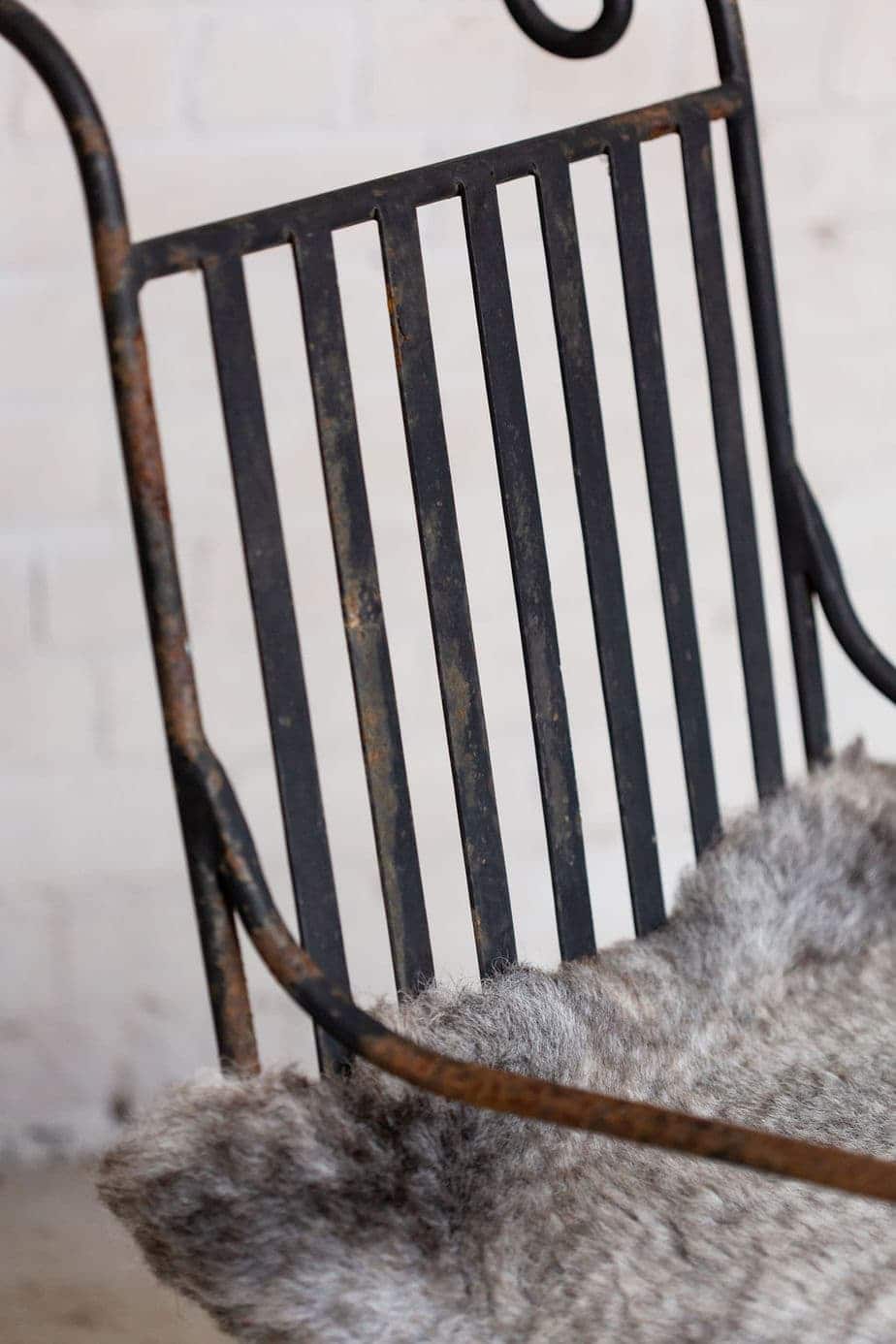 A Pair of Elegant Antique Rocking Chairs in Wrought Iron