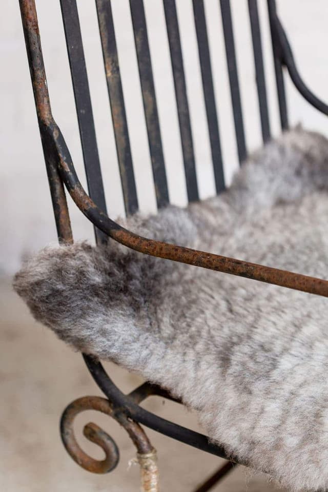 A Pair of Elegant Antique Rocking Chairs in Wrought Iron