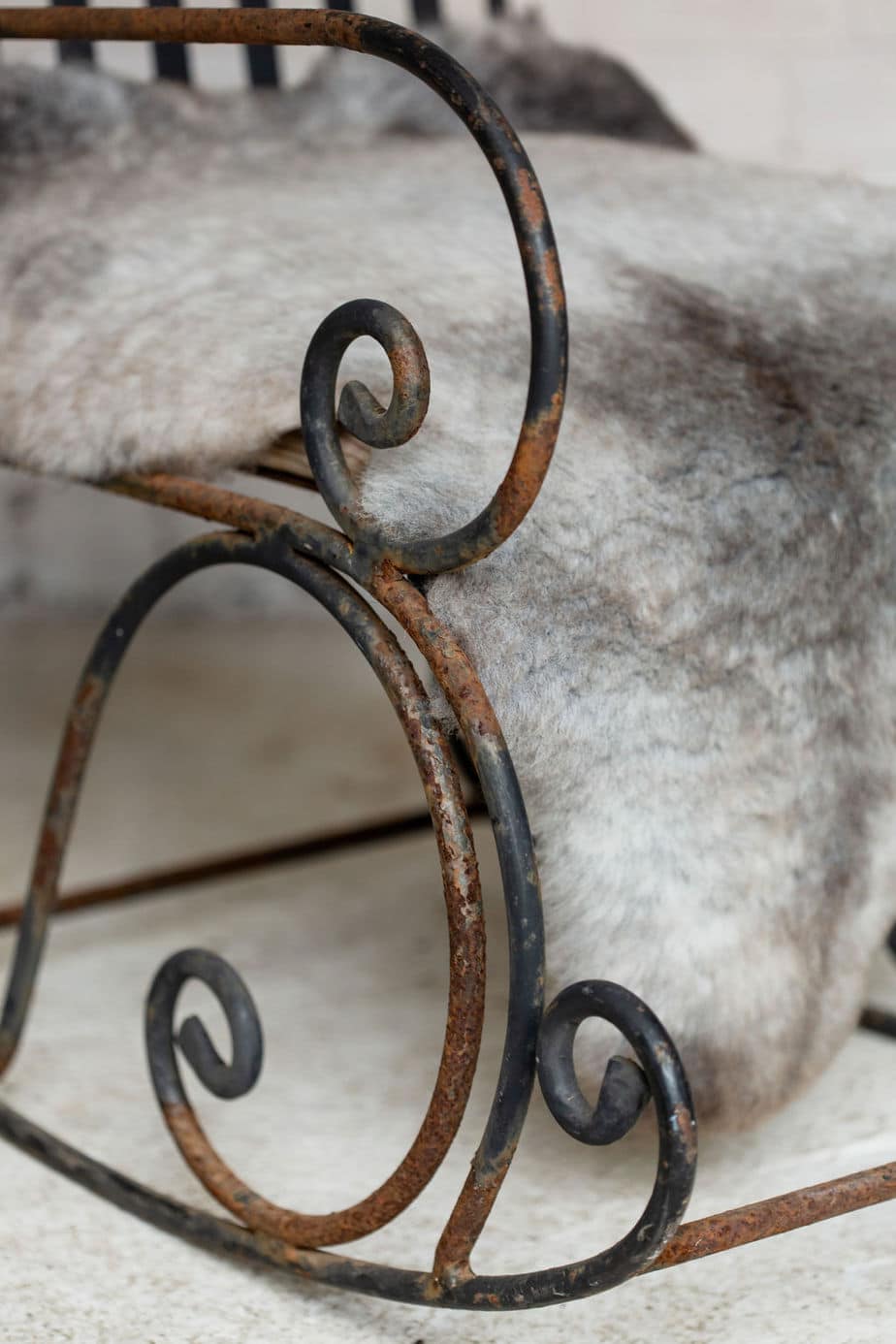 A Pair of Elegant Antique Rocking Chairs in Wrought Iron