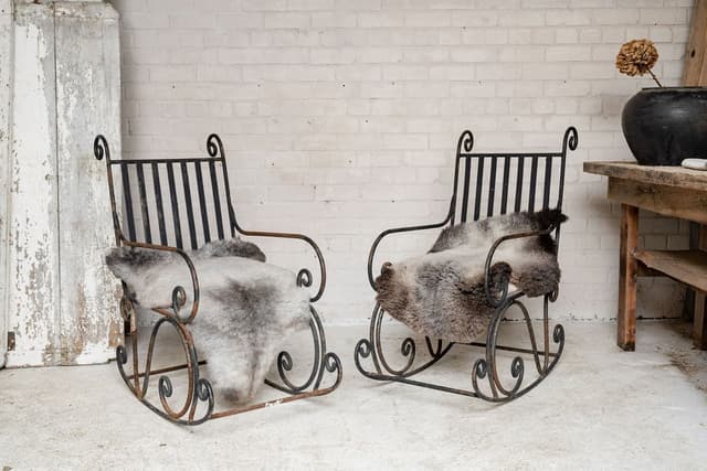 A Pair of Elegant Antique Rocking Chairs in Wrought Iron